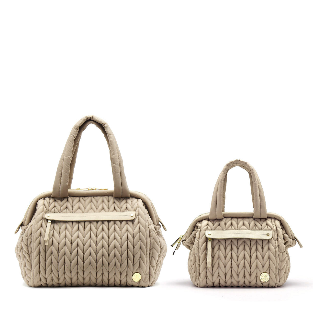 Paige Mini Beige purse style diaper bag next to the larger Paige Carryall version.