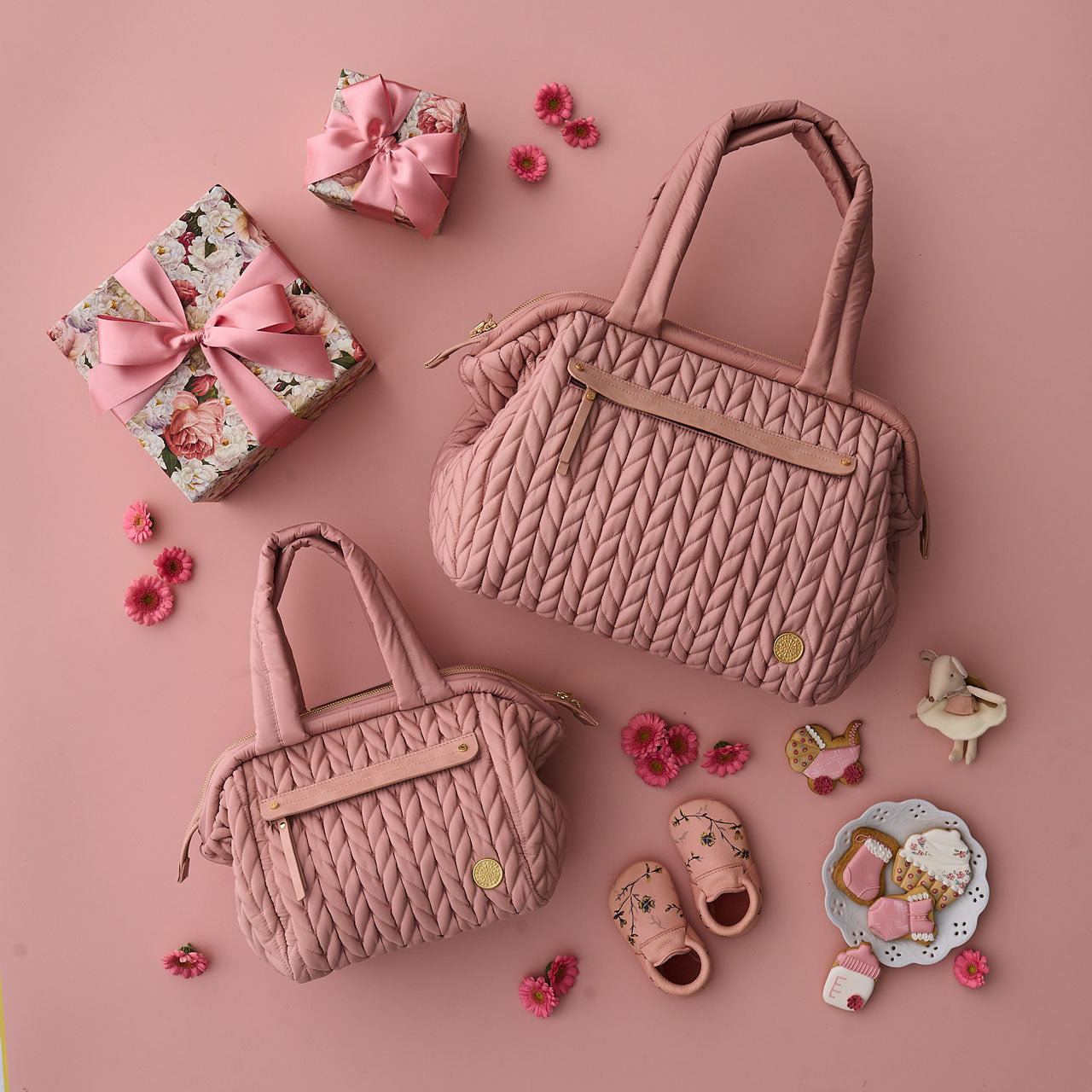 Size comparison of Paige Mini Rose vs. the Carryall version; it's about half the size.
