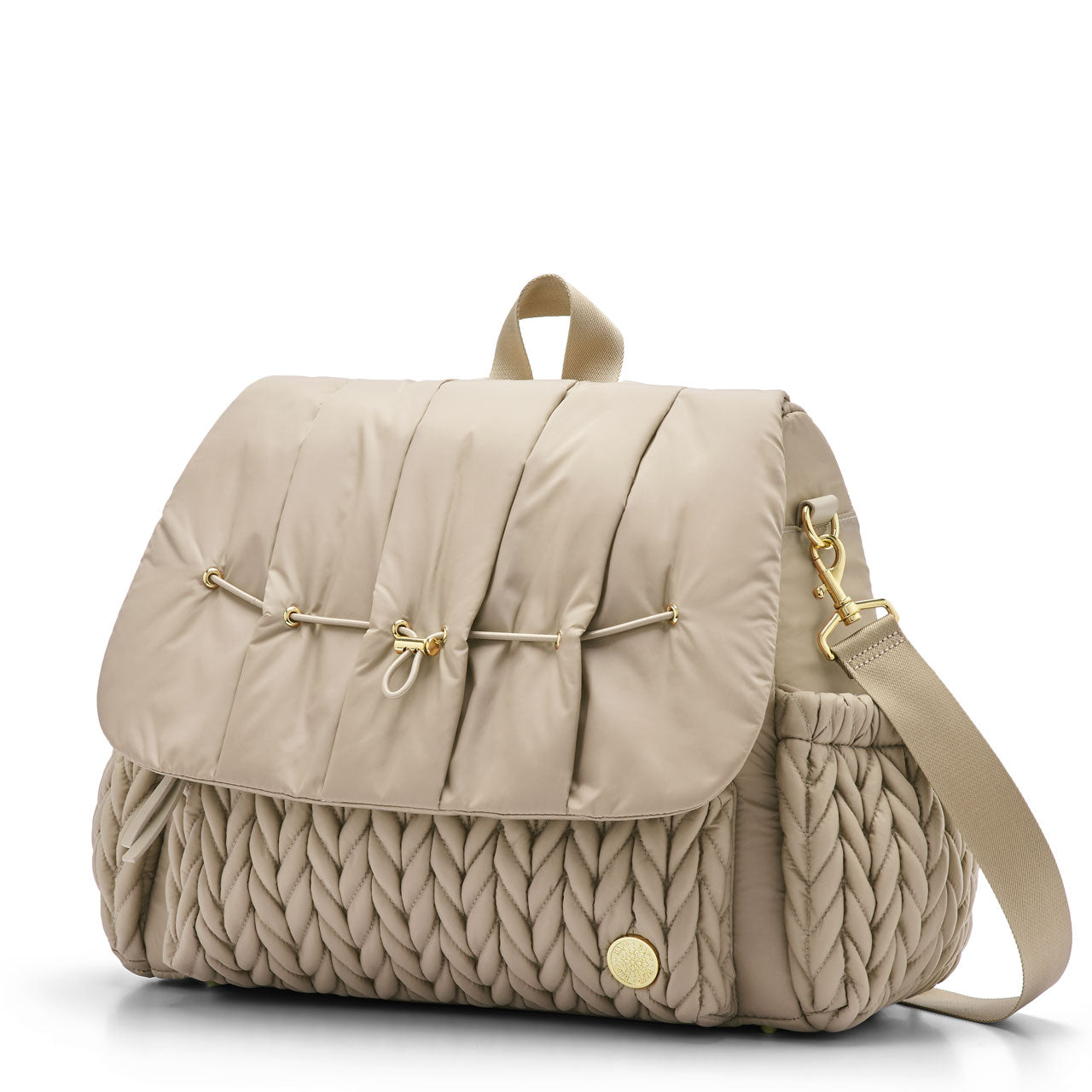 3/4 view of Levy Backpack Beige, standing upright and zipped closed, with detachable messenger strap attached. Shows luxe, 3D herringbone fabric, top carry strap, and gold hardware details.