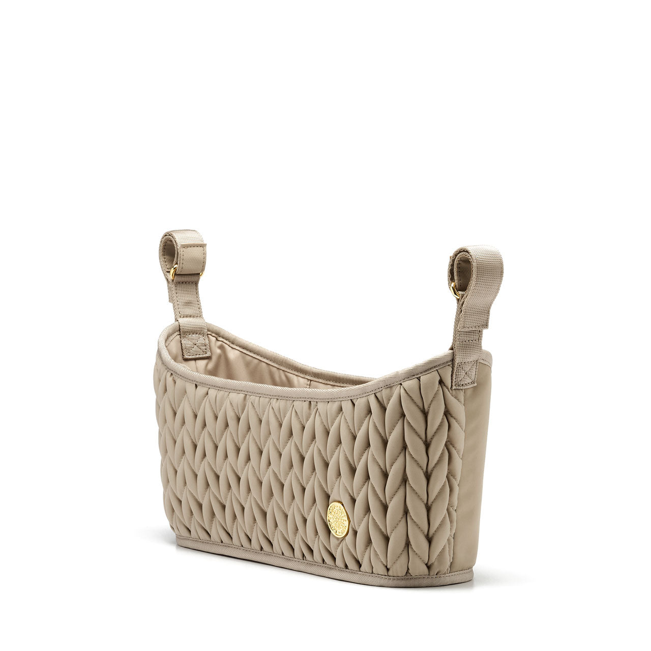 Three-quarters angle of Beige stroller organizer, empty and standing upright, showing its structure, quality construction, 3D quilted fabric, and adjustable grippy straps.