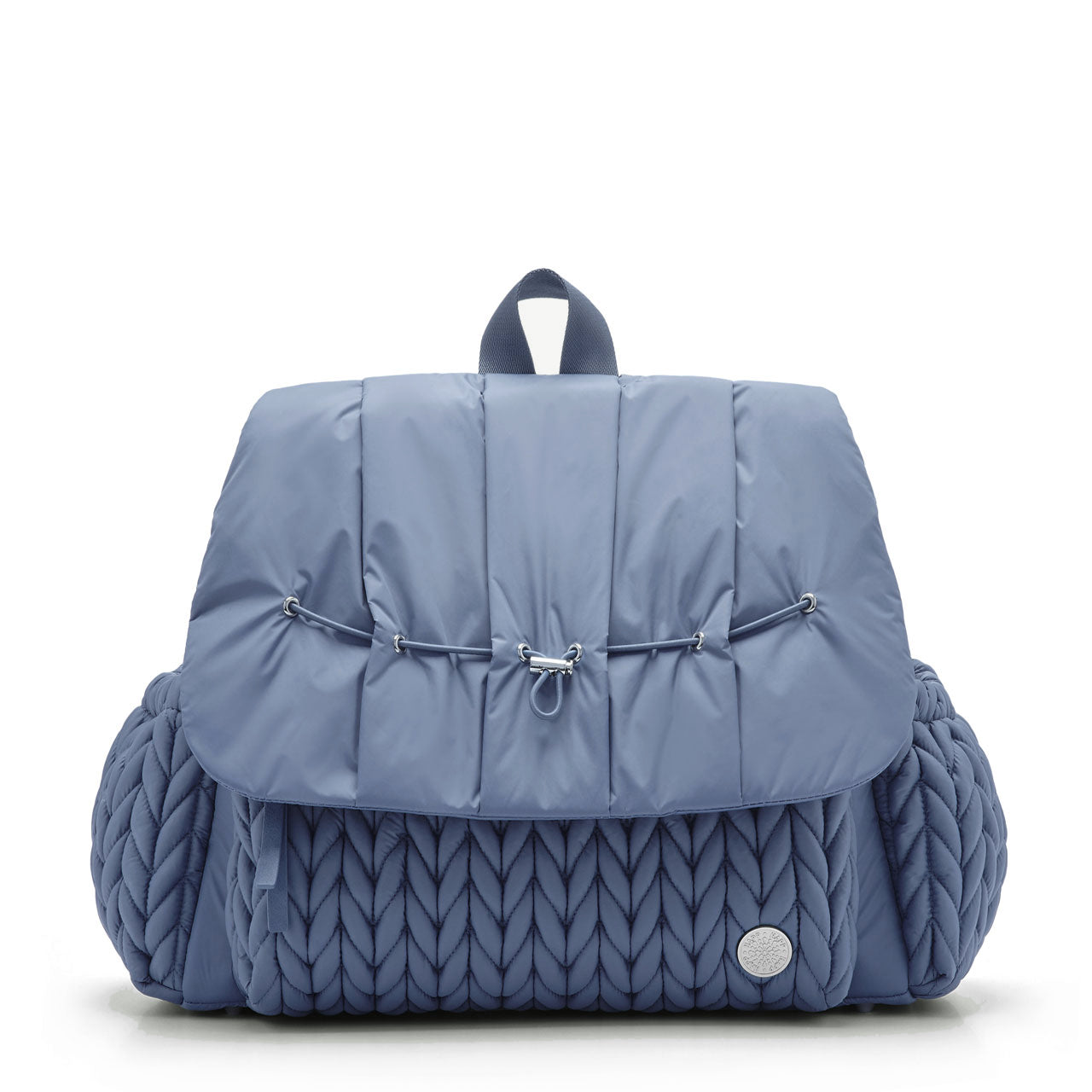 A blue Levy backpack with a wide zippered flap and wide straps, featuring a quilted pattern on the front compartment and a silver logo emblem.