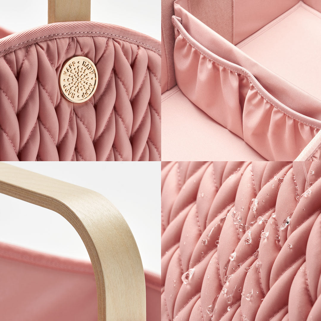 4-photo grid of Rose Diaper Caddy details; gold hardware on 3D herringbone, detachable pocket divider, sleek lightweight wooden handle, and water droplets on water-resistant wipeable fabric.