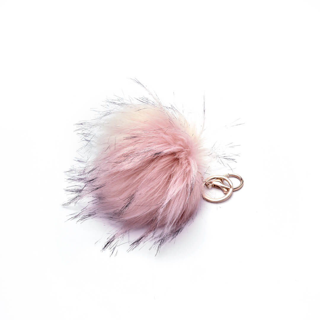 Faux fur pouf keychain in rose with key ring and clip attachments.