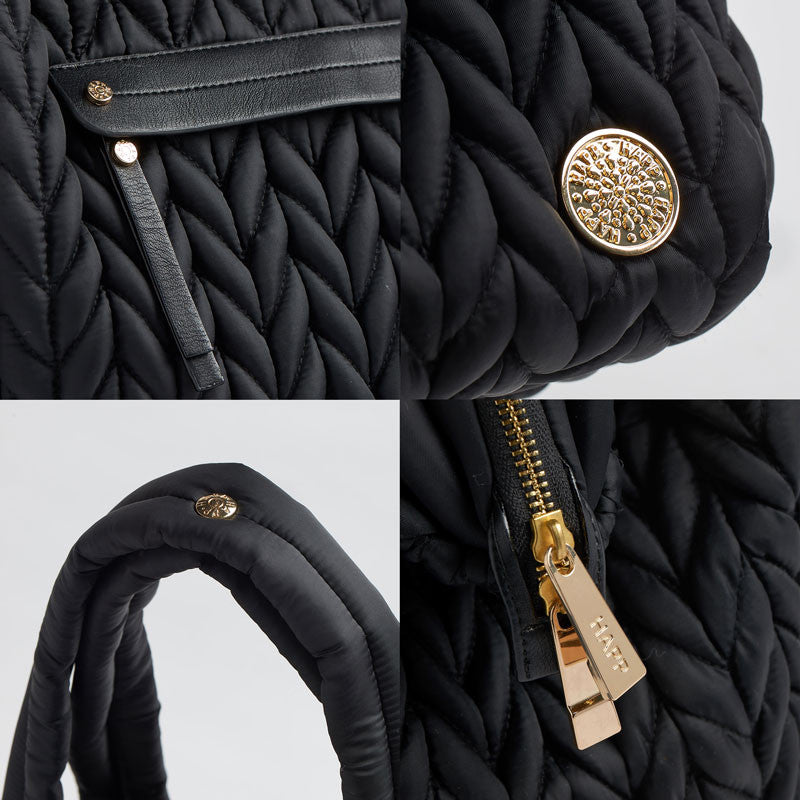 4-photo grid of Paige Carryall Black details, including matching faux leather trim and zipper pull on mommy pocket, gold logo and zipper hardware details, and convenient snap on padded carry handles.