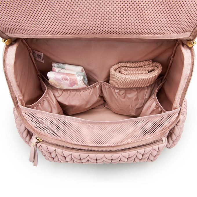 Levy Backpack Dusty Rose shown open from the top down to show the spacious main compartment and 4 interior pockets for easy organization. Bag is lined with rose fabric.