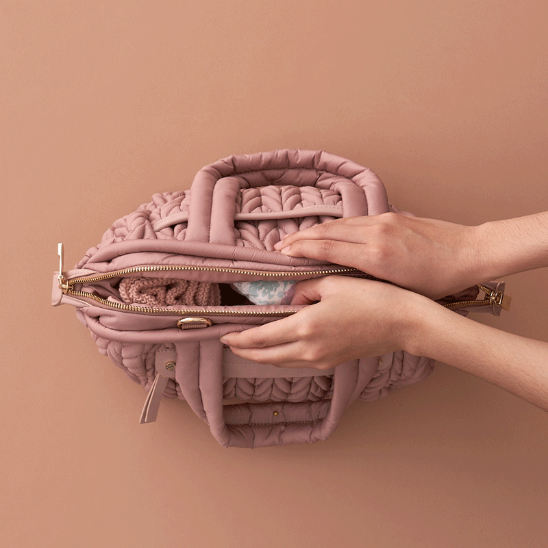 Moving GIF image of a pair of hands opening and closing the Mary Poppins style bag opening of the Paige Mini Dusty Rose