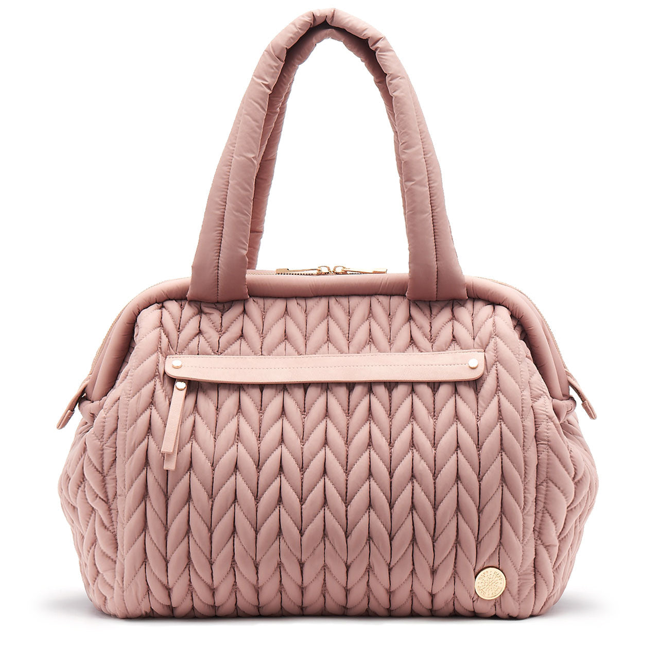 A dusty rose-colored Paige Carryall diaper bag with a structured design and quilted texture.