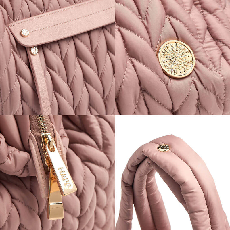 Paige Carryall purse handbag style diaper bag with quilted herringbone nylon in dusty rose blush pink with gold hardware closeup padded strap zipper